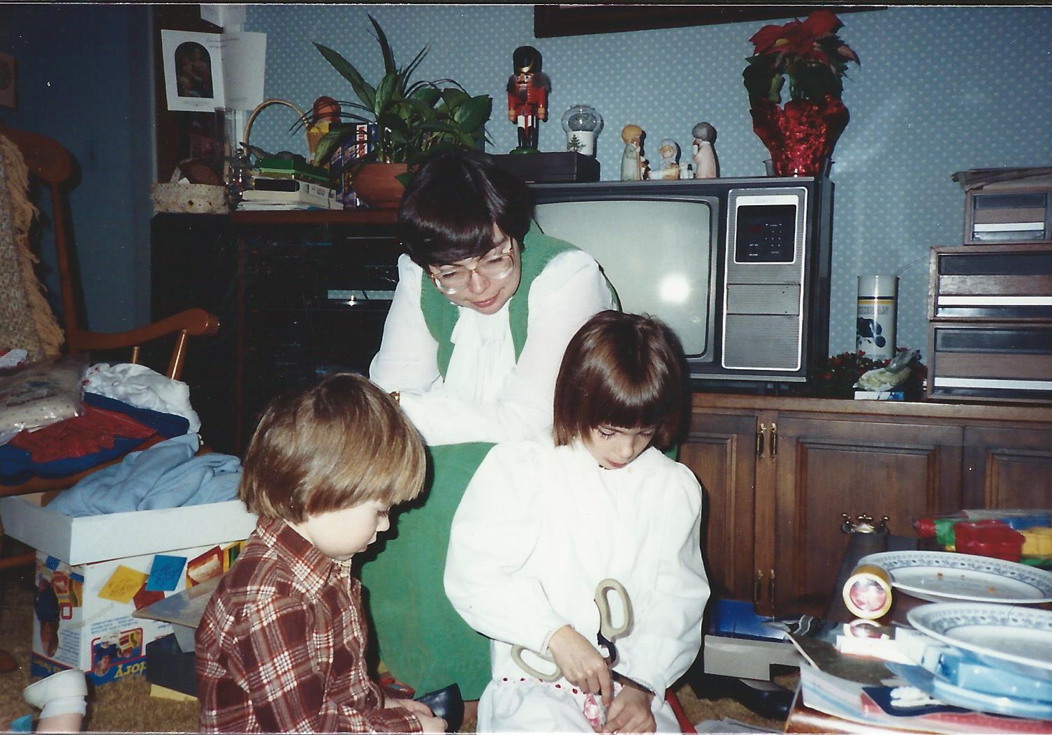 Marilyn, Sarah, and Rebecca at
Christmas time in our house, December 25, 1987